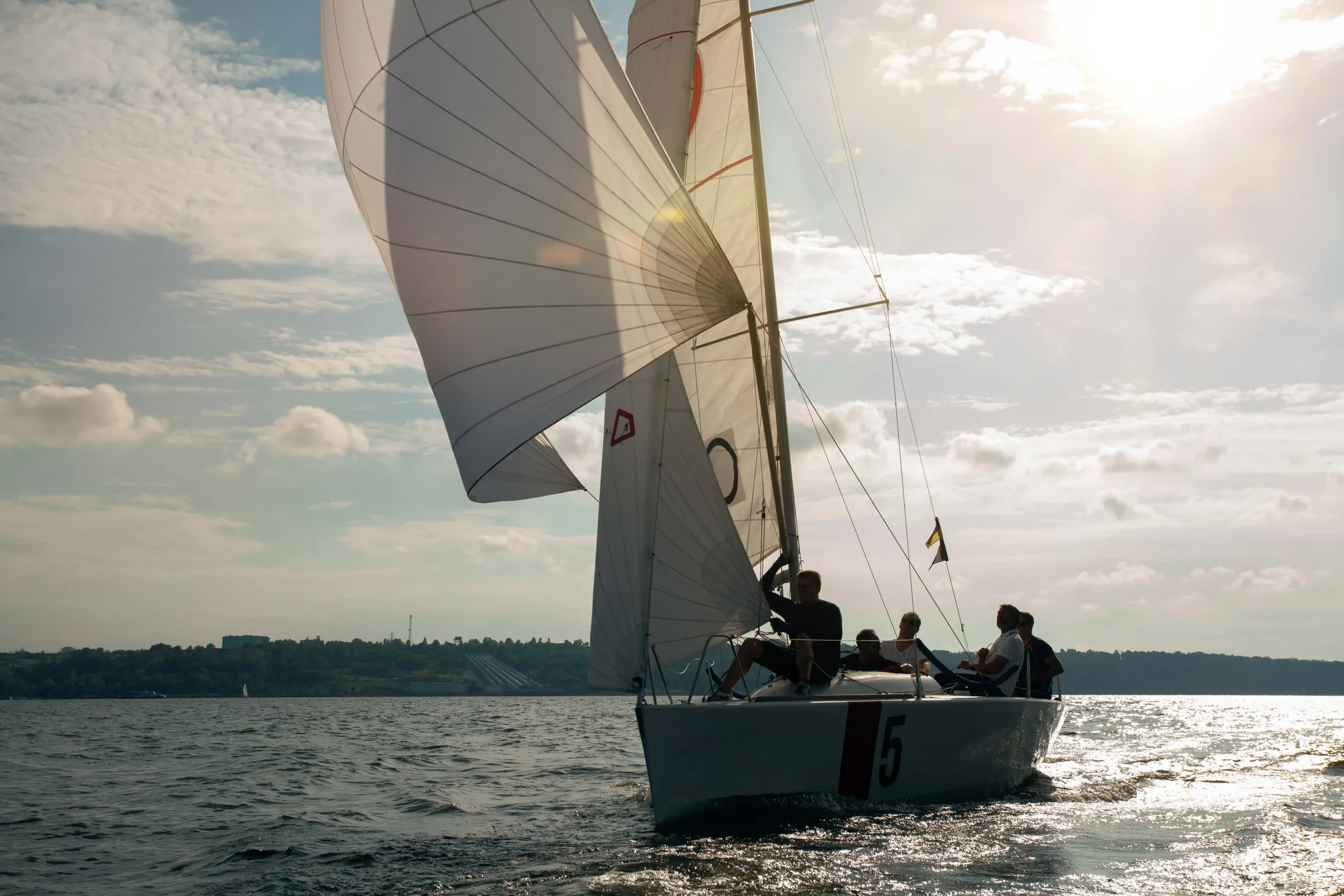 Group of learners practicing sailboat handling in Florida sailing school
