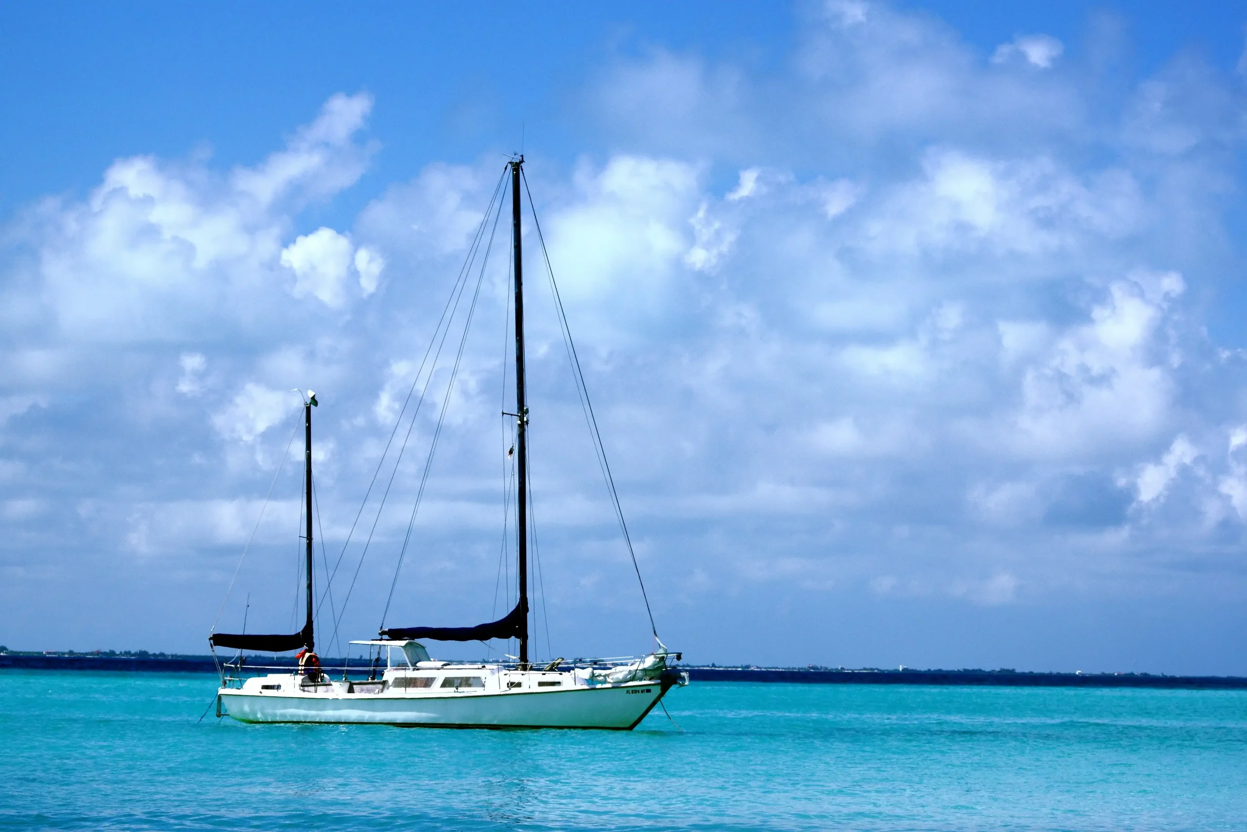 Group of learners practicing sailboat handling in Florida sailing school